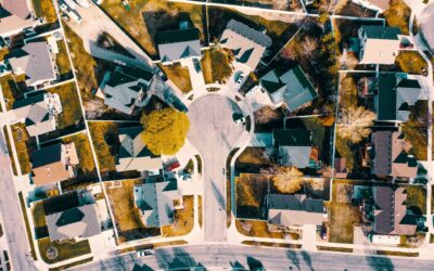 Aerial view of suburban neighborhood with well-maintained houses, illustrating Rochester Property Management Group's expertise in residential property management.