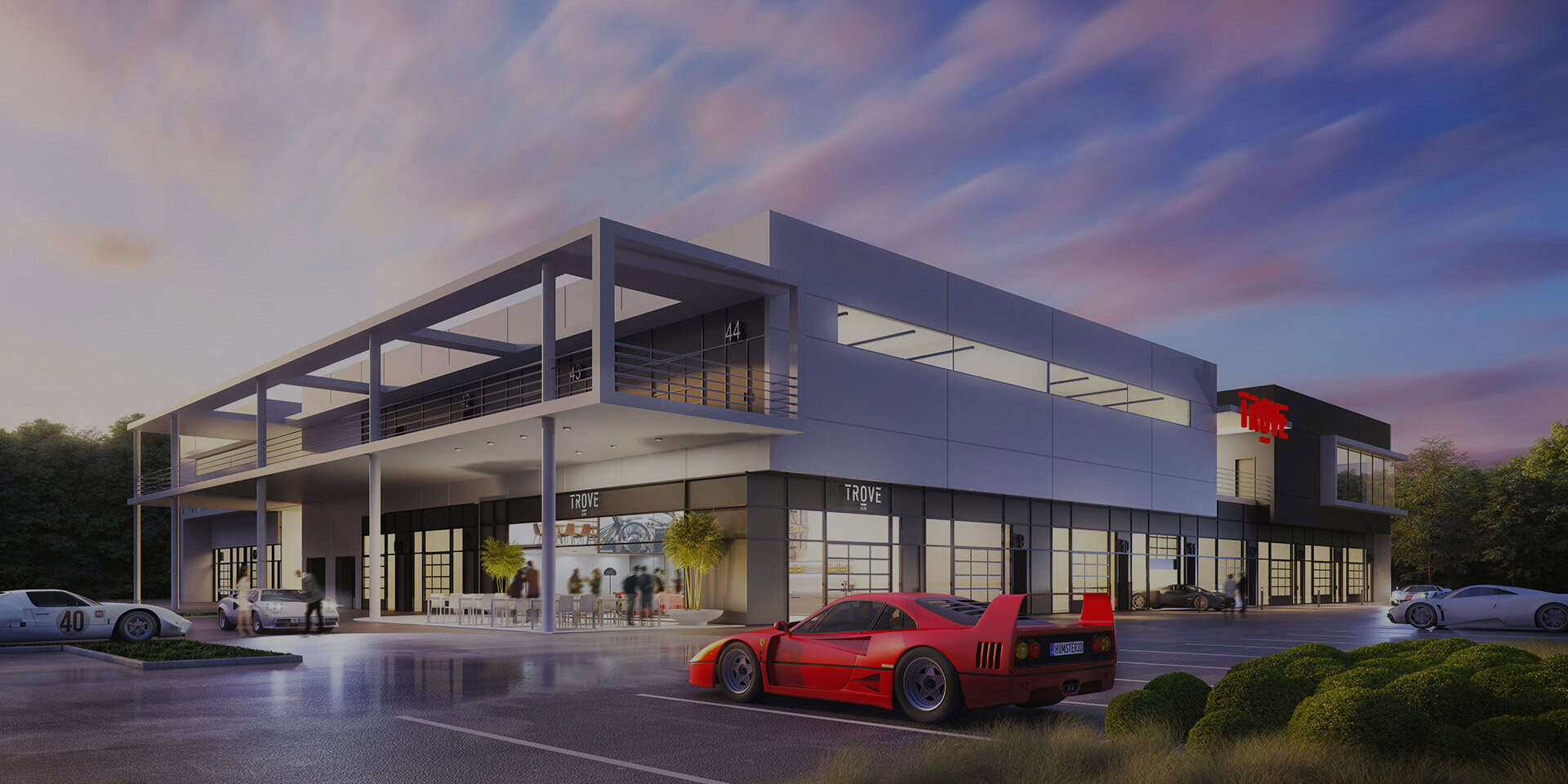 Modern commercial building with glass storefronts and outdoor seating, showcasing Rochester Property Management Group's professional office space and prime retail location in Rochester.