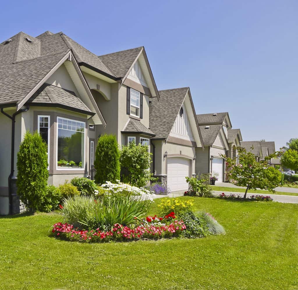 Luxury suburban homes in Rochester with well-maintained lawns and beautiful landscaping, ideal for property management services in the Rochester area.
