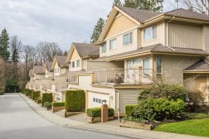 Spacious multi-family townhomes with well-maintained landscaping and private balconies, located in a peaceful residential community managed by Rochester Property Management Group.
